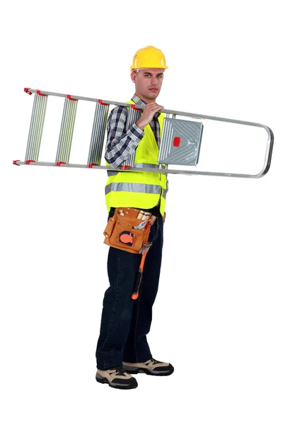 A handyman carrying a ladder. — Stock Photo, Image