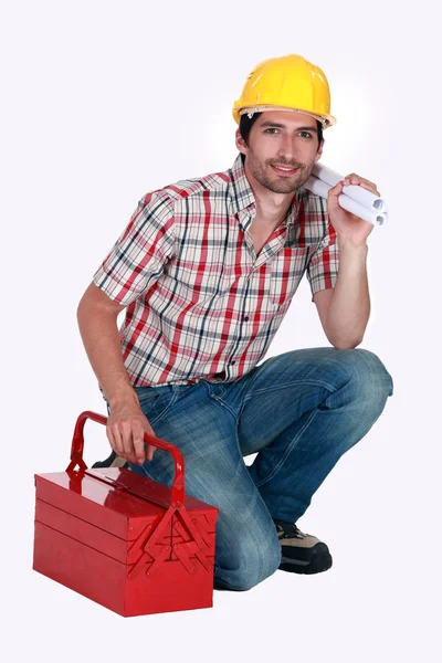 Een voorman met een toolbox. — Stockfoto
