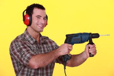 Man with a power drill clipart