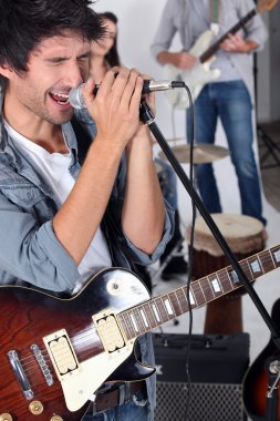 Man singing in a band clipart
