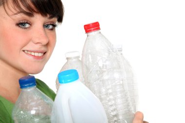 Woman holding plastic bottles clipart