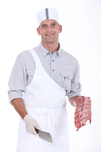 Butcher with chops — Stock Photo, Image