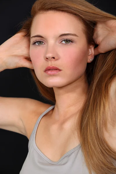 Model running hands through hair — Stock Photo, Image