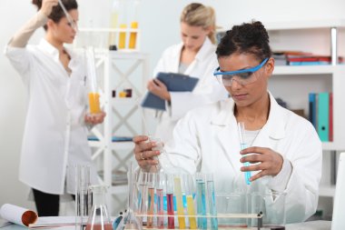 Women conducting an experiment clipart