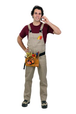 Repairman talking on a cellphone clipart