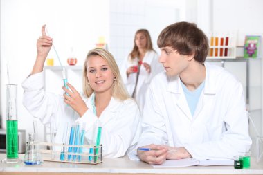 Science students in laboratory clipart