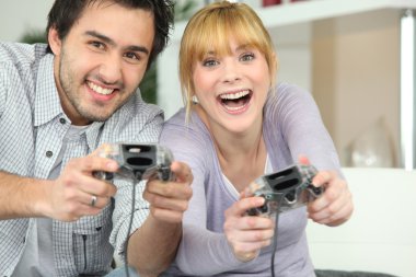 Couple playing video games clipart