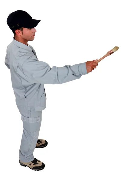 Decorator holding paint brush — Stock Photo, Image