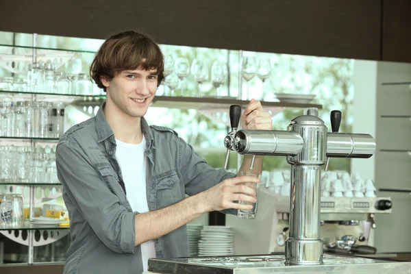 stock image Barman stood by pump