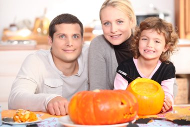 Family carving pumpkins together clipart