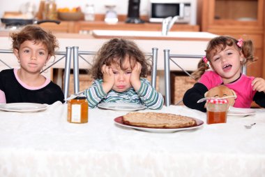 Three children eating crepes clipart