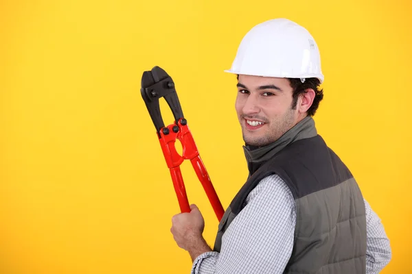 Glad workman på gul bakgrund — Stockfoto