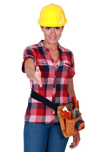 Женщина-работница держит руку — стоковое фото