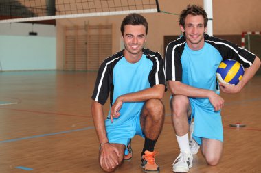 Volleyball players kneeling clipart