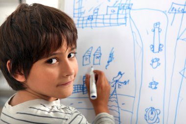 Child drawing a street scene clipart