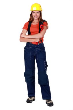 Happy tradeswoman holding a pipe wrench clipart