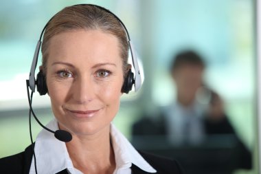 Woman smiling with headset clipart