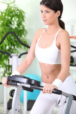 Woman on a treadmill clipart