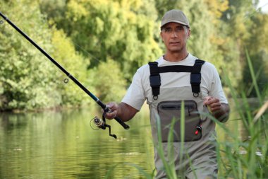 Man fishing in river clipart