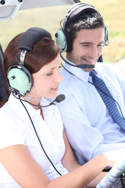 Couple in the cockpit of a light aircraft — Stock Photo, Image