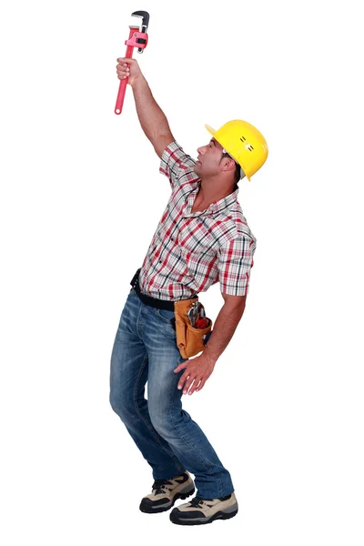 Man holding up adjustable spanner — Stock Photo, Image