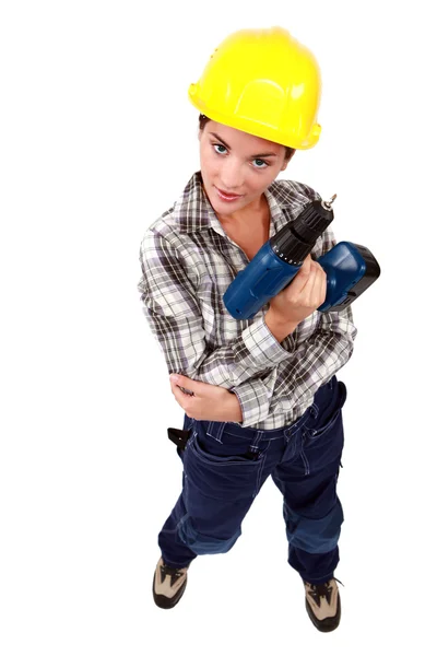 Sexy Handwerkerin mit einer Bohrmaschine — Stockfoto