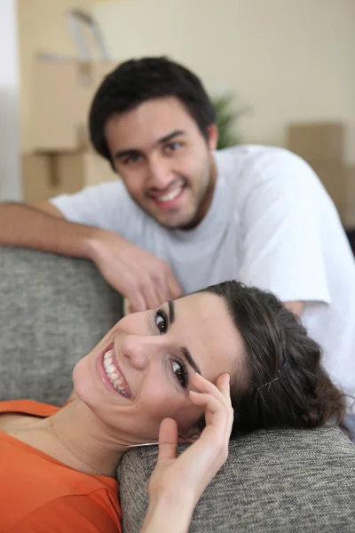 Couple laying on sofa after long day — Stock Photo, Image