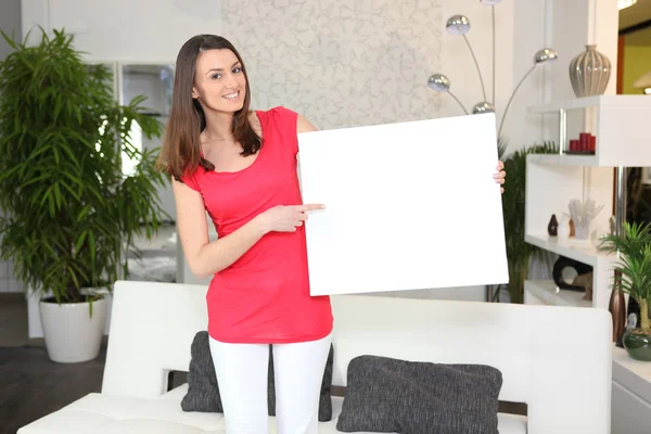 stock image Woman pointing to a sign