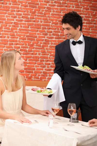 Waiter serving lunch — Stock Photo, Image