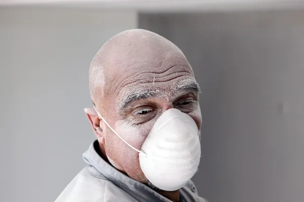 Bald plasterer covered in dust — Stock Photo, Image