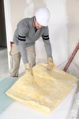 Plasterer doing repairs in house clipart