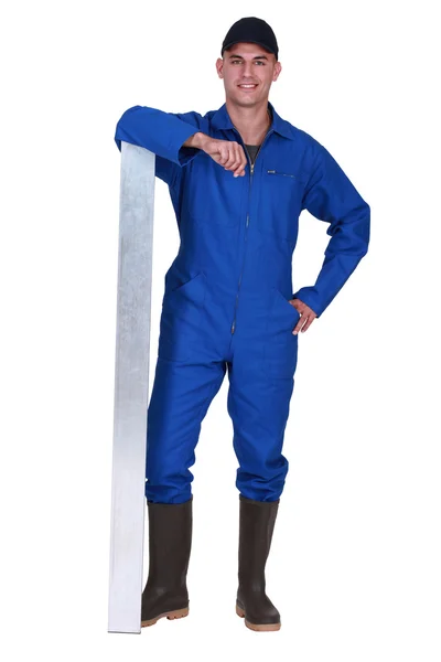 Werknemer in blauwe overalls — Stockfoto