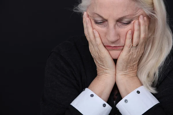 Senior woman looking sad and lonely — Stock Photo, Image