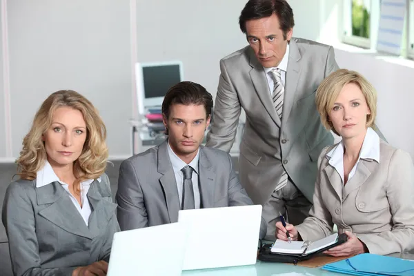 Serious team of executives — Stock Photo, Image