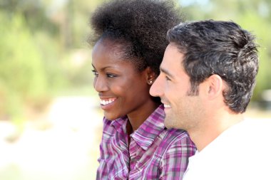 An interracial couple spending time together clipart