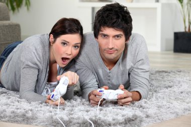 Couple playing a video game together clipart