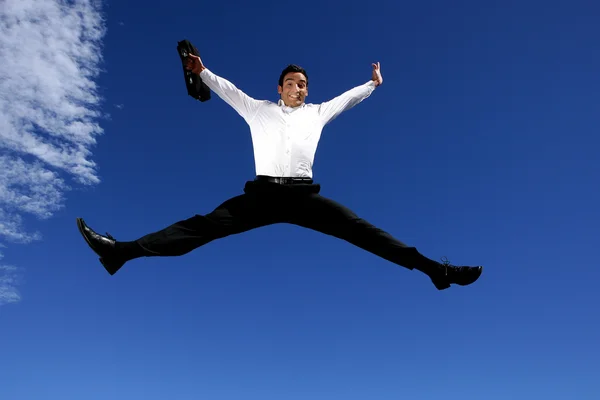 Empresário com pasta saltando de alegria — Fotografia de Stock