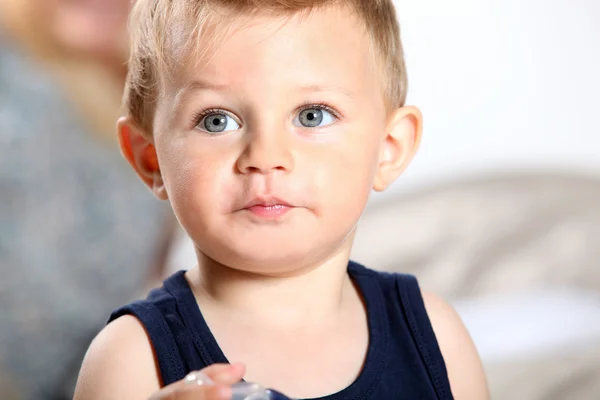 Young boy holding a teat — Stock Photo, Image
