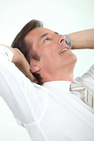 Male executive taking a break to relax — Stock Photo, Image