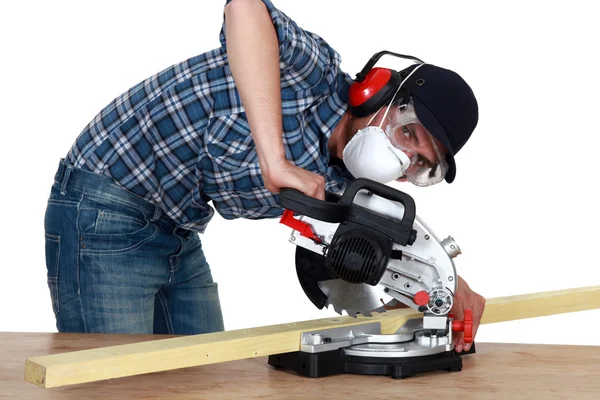 Man using a mitre saw — Stock Photo, Image