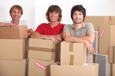 Teenagers moving together into a new apartment clipart