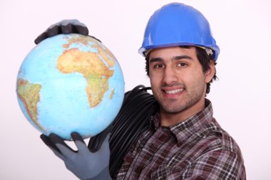 Manual worker holding globe clipart