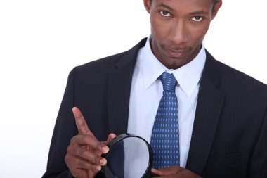 Portrait of a man with magnifying glass clipart