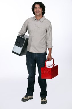 A toolbox in one hand, a computer in the other. clipart