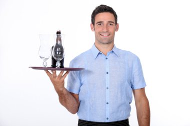 A waiter bringing a bottle of liquor. clipart