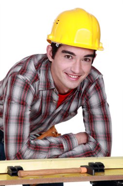 Portrait of a young construction worker clipart
