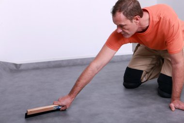 Craftsman leveling the floor clipart