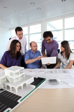 Group of working in an architect's office clipart