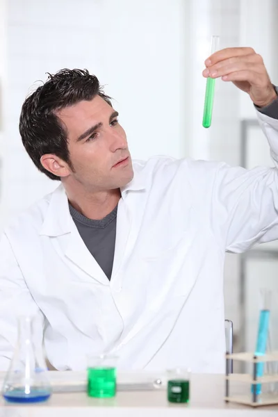 Scientist with test tube rack — Stock Photo, Image