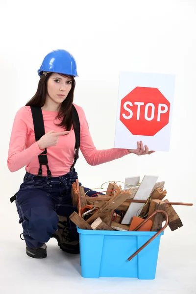Woman holding stop sign — Stock Photo, Image